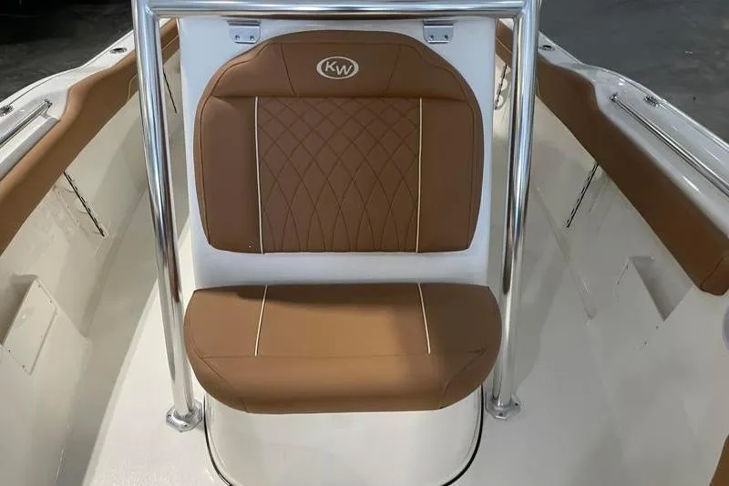 Slide: The Image of 2025 Key West 239 FS boat seat with brown leather upholstery and chrome frame. - 24