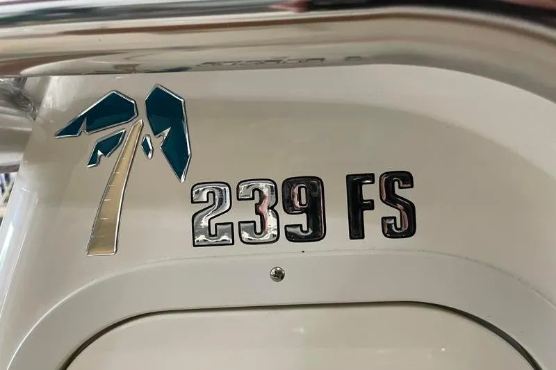 Slide: The Image of Key West 239 FS 2025 boat logo with palm tree design. - 29