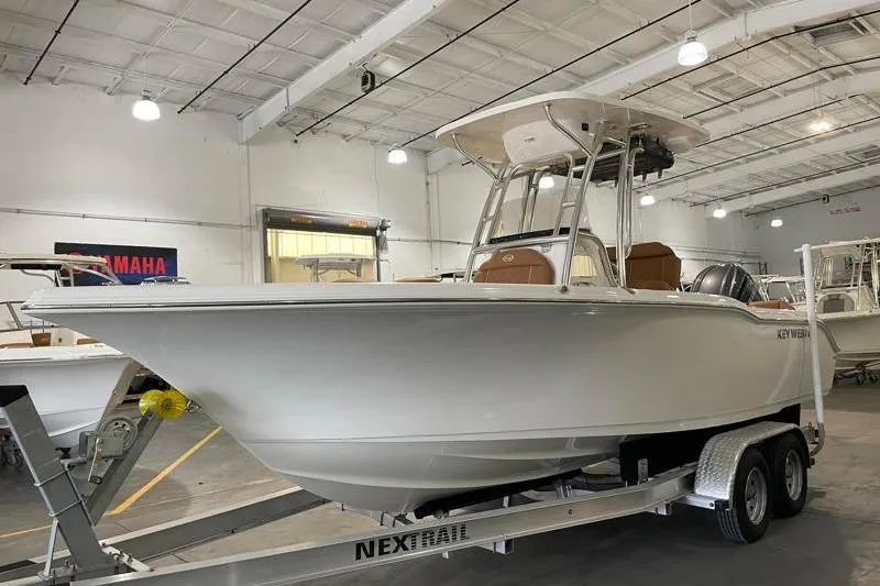 Slide: The Image of 2025 Key West 239 FS boat on trailer in indoor showroom. - 3