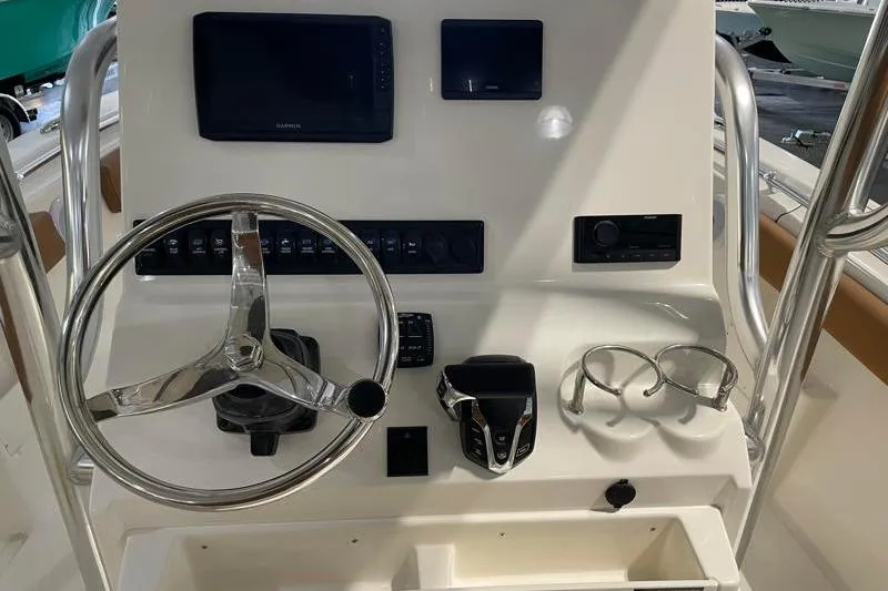 Slide: The Image of Steering console of 2025 Key West 239 FS boat with modern controls and displays. - 32