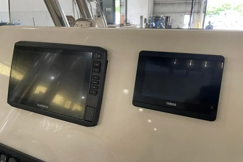 Slide: The Image of Garmin and Yamaha displays on 2025 Key West 239 FS boat dashboard. - 34