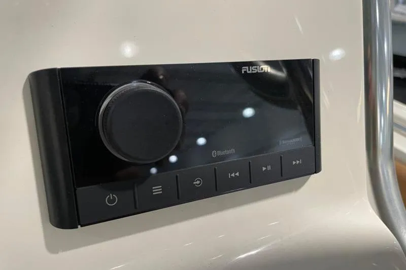 Slide: The Image of Control panel of a 2025 Key West 239 FS boat with Bluetooth functionality. - 36