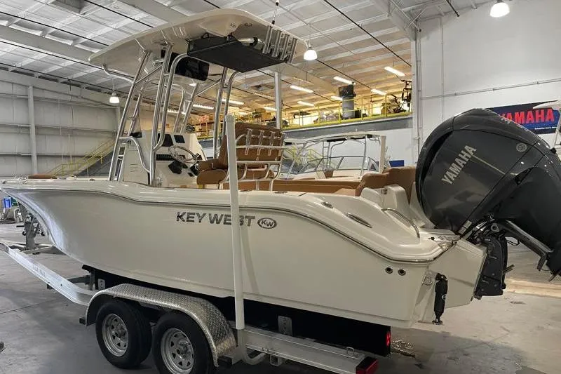 Slide: The Image of 2025 Key West 239 FS boat with Yamaha engine in a showroom. - 4