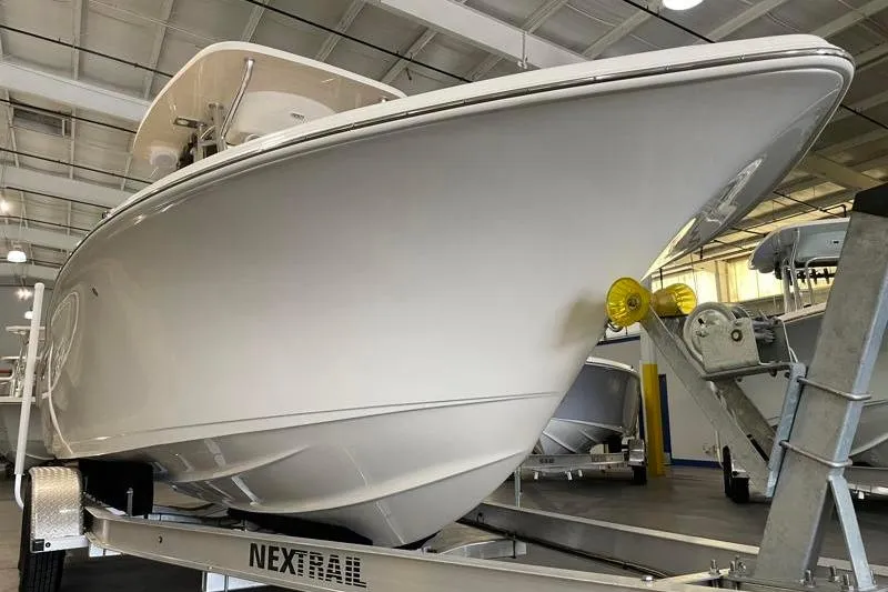 Slide: The Image of 2025 Key West 239 FS boat on trailer in indoor showroom. - 7
