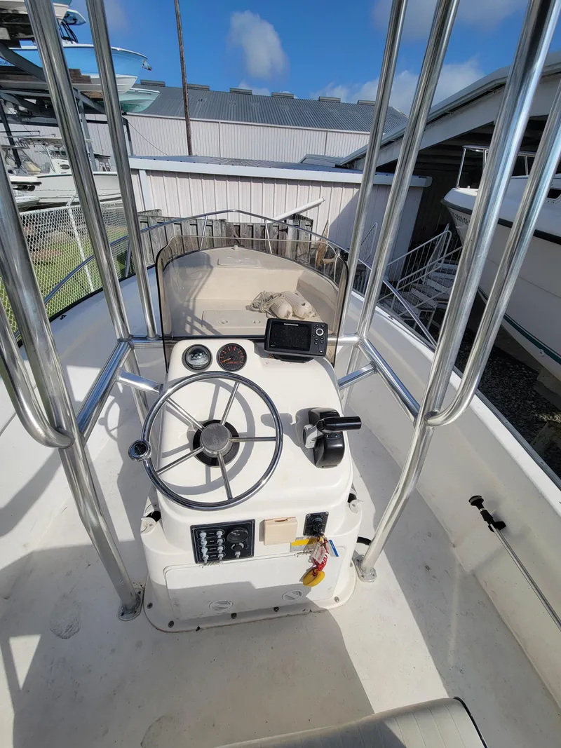 Slide: The Image of 2005 Palm Beach 181 boat cockpit with steering wheel and controls. - 4