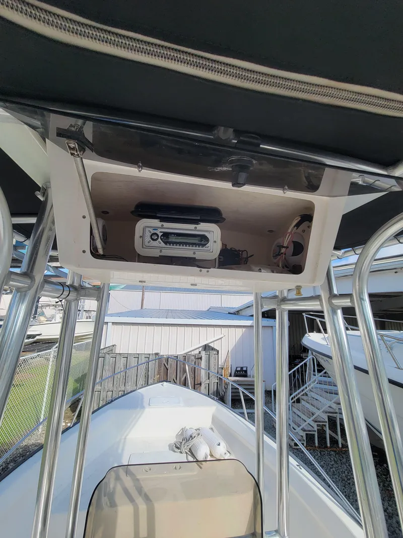 Slide: The Image of 2005 Palm Beach 181 boat interior with overhead console and radio system. - 5