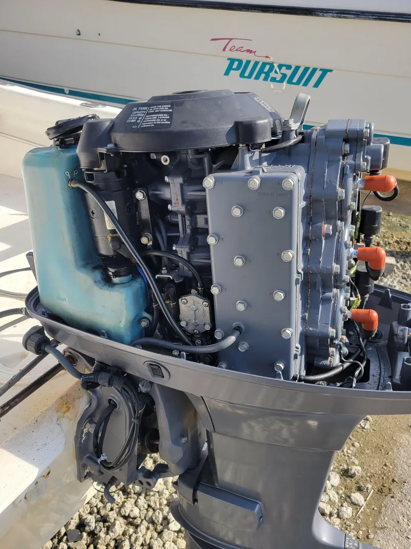 Slide: The Image of 2005 Palm Beach 181 outboard motor, detailed view, mounted on a boat. - 8