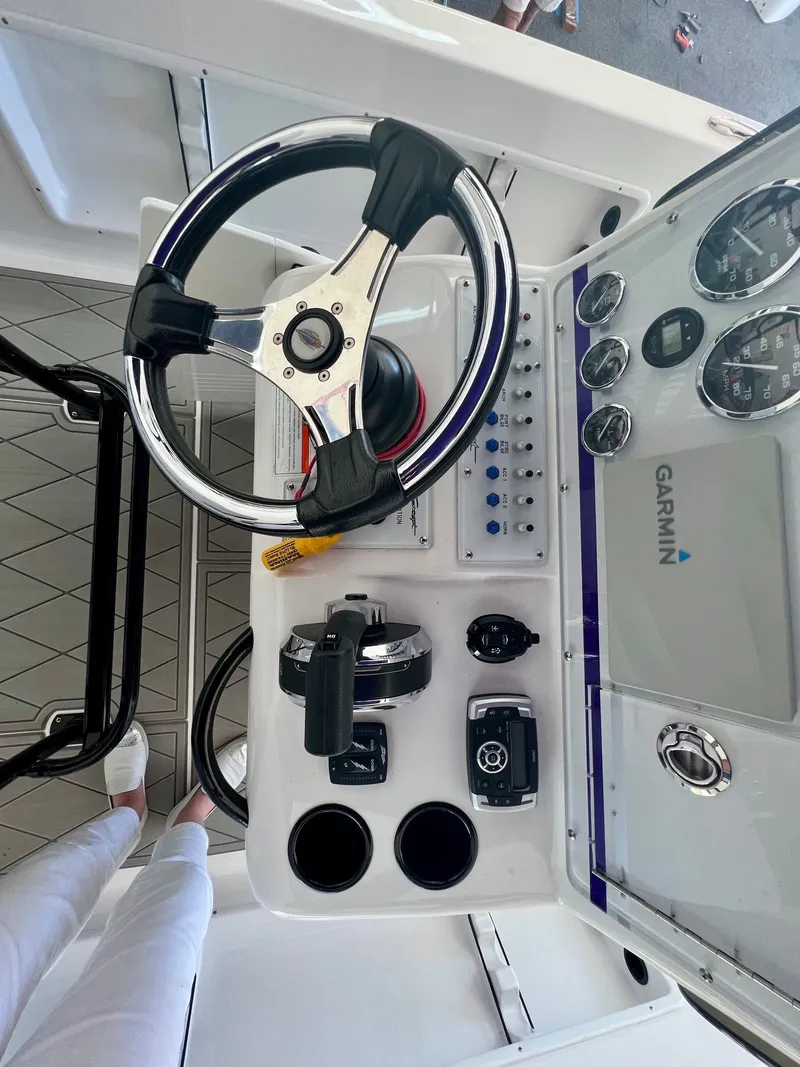 Slide: The Image of Steering console of a 2018 Concept 23 boat with Garmin technology. - 13