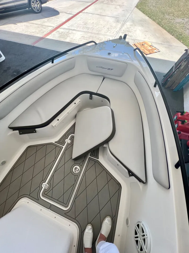 Slide: The Image of Interior of a 2018 Concept 23 boat with gray upholstery. - 9
