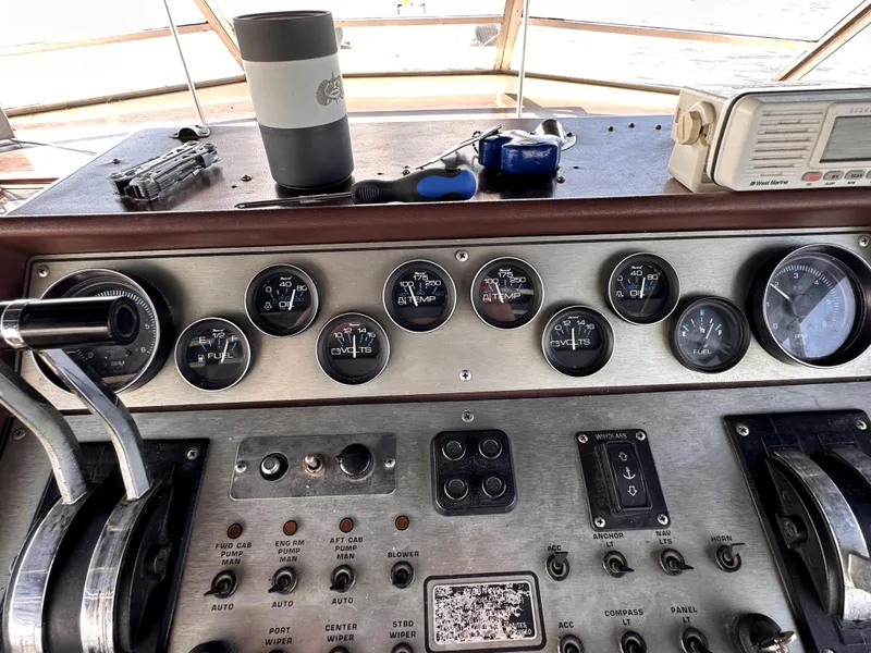 Slide: The Image of 1985 Chris-Craft 381 Catalina dashboard with gauges, controls, and marine equipment. - 4