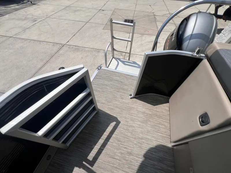 Slide: The Image of 2022 Bennington 22 LS boat with open gate and ladder on deck. - 16