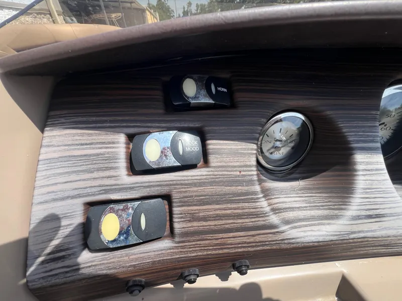 Slide: The Image of Dashboard of 2022 Bennington 22 LS boat with switches and gauge. - 19