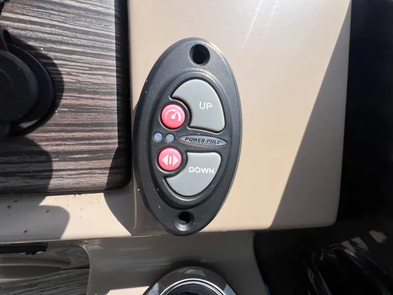 Slide: The Image of Control panel with up and down buttons on a 2022 Bennington 22 LS boat. - 21