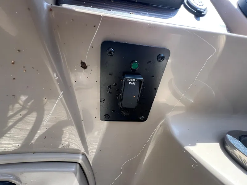 Slide: The Image of Control panel switch on 2022 Bennington 22 LS boat dashboard. - 22