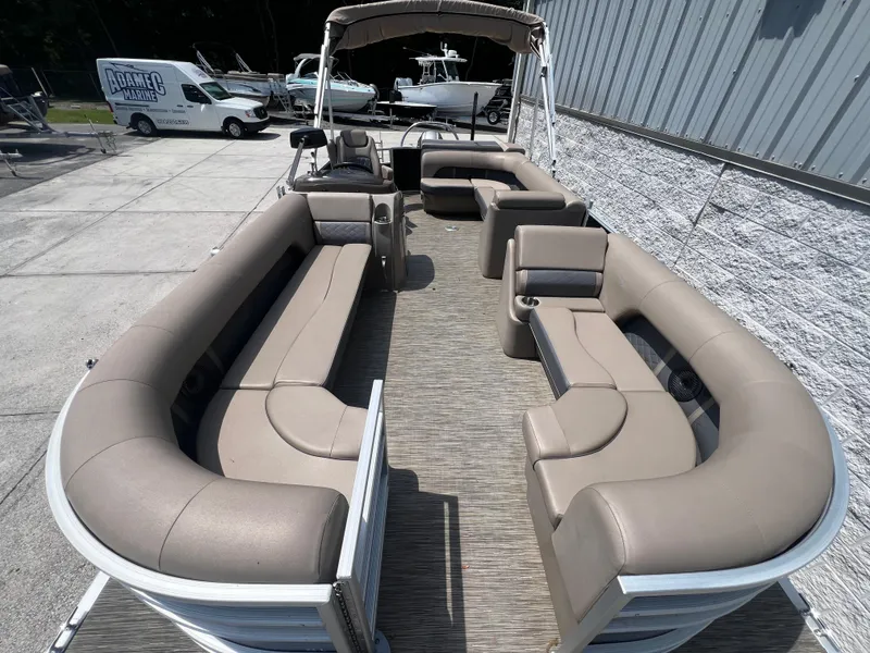 Slide: The Image of 2022 Bennington 22 LS pontoon boat with spacious seating and modern design. - 5