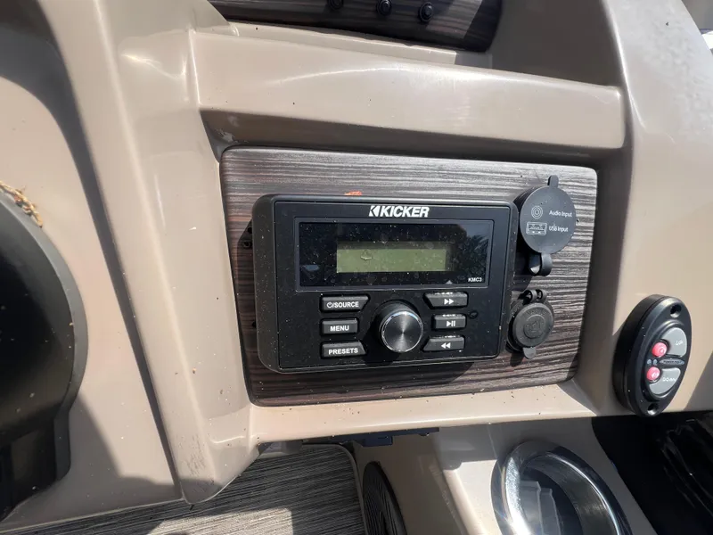 Slide: The Image of Kicker audio system on 2022 Bennington 22 LS boat dashboard. - 9