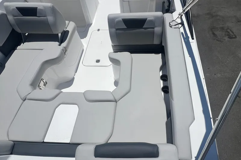 Slide: The Image of 2025 Hurricane SunDeck Sport 2050 OB boat interior with gray seating and spacious layout. - 11