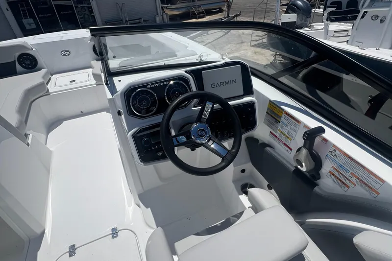 Slide: The Image of 2025 Hurricane SunDeck Sport 2050 OB boat cockpit with Garmin navigation system. - 4