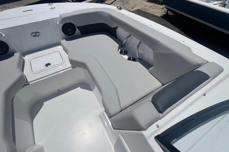 Slide: The Image of 2025 Hurricane SunDeck Sport 2050 OB boat interior with gray seating and cup holders. - 6