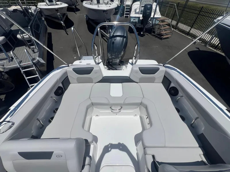 Slide: The Image of 2025 Hurricane SunDeck Sport 2050 OB boat interior with spacious seating and modern design. - 8