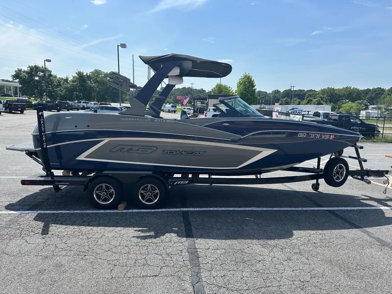 Slide: The Image of 2022 MB F22 Tomcat Alpha boat on trailer in parking lot, sunny day. - 2