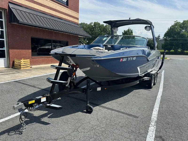 Slide: The Image of 2022 MB F22 Tomcat Alpha boat on trailer in parking lot, sunny day. - 3