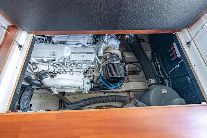 Slide: The Image of Engine compartment of 2015 Beneteau Swift Trawler 34, featuring a Cummins engine. - 26