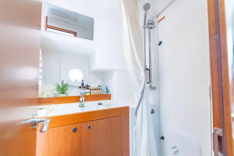 Slide: The Image of Bathroom interior of 2015 Beneteau Swift Trawler 34, featuring sink and shower. - 31