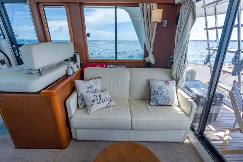 Slide: The Image of Interior of 2015 Beneteau Swift Trawler 34 with cozy seating and ocean view. - 44