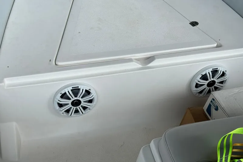 Slide: The Image of 2004 AB Inflatables 570 VST boat interior with speakers and storage compartment. - 17