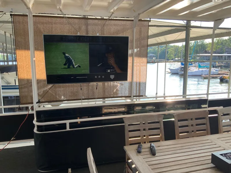 Slide: The Image of Outdoor seating area on a 2007 Skipperliner 640 with TV and lake view. - 13