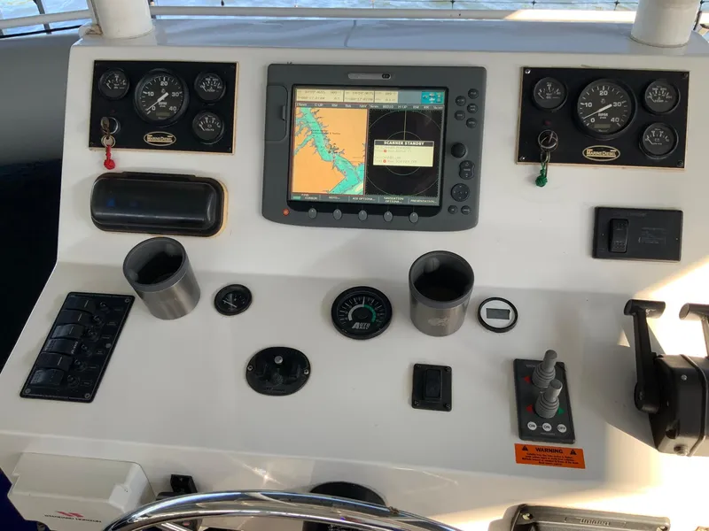 Slide: The Image of Control panel of a 2007 Skipperliner 640 boat with navigation equipment and gauges. - 19