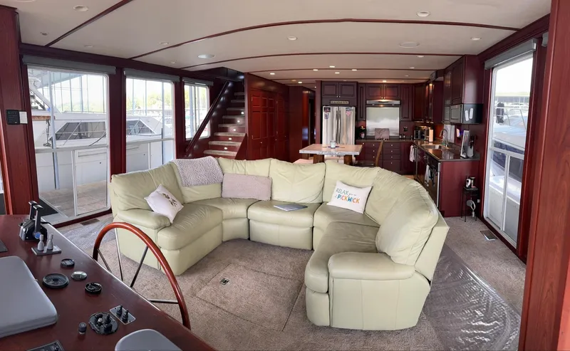 Slide: The Image of Luxurious 2007 Skipperliner 640 interior with plush seating and modern kitchen amenities. - 22