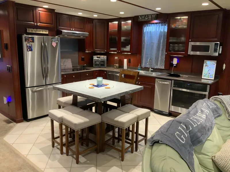 Slide: The Image of Luxurious kitchen interior on a 2007 Skipperliner 640 yacht, featuring modern appliances and elegant cabinetry. - 26