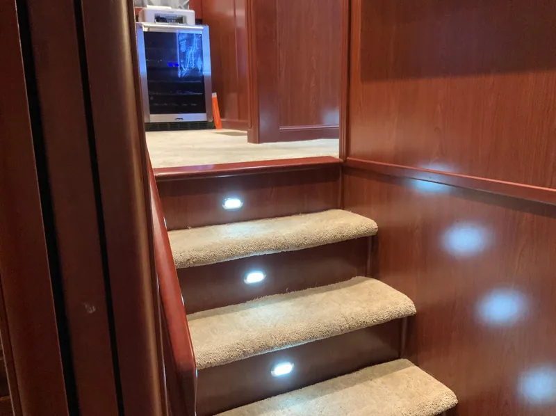 Slide: The Image of Carpeted stairs with LED lights in a 2007 Skipperliner 640 yacht interior. - 41