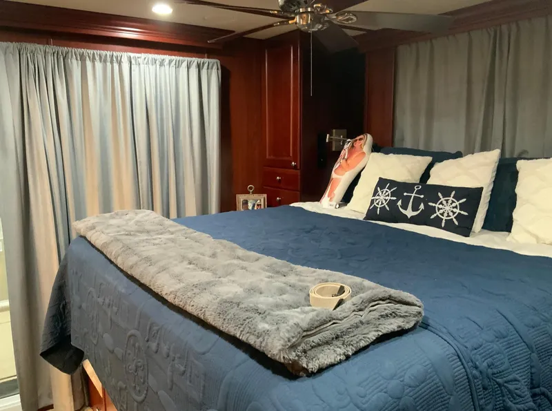 Slide: The Image of Luxurious bedroom interior of 2007 Skipperliner 640 with nautical-themed decor. - 49