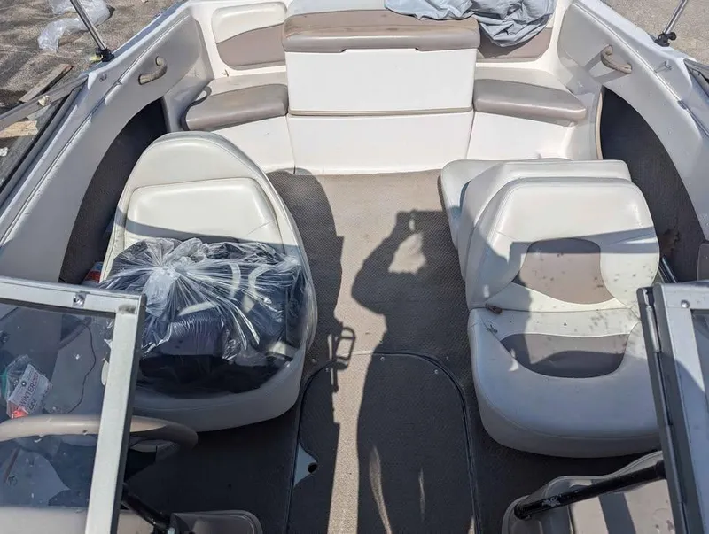 Slide: The Image of 2003 Four Winns Freedom 170 boat interior with seating and shadow. - 15