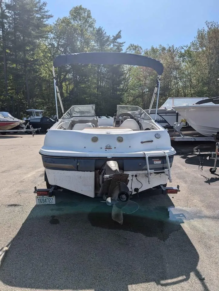 Slide: The Image of 2003 Four Winns Freedom 170 boat, rear view, parked outdoors on a sunny day. - 3