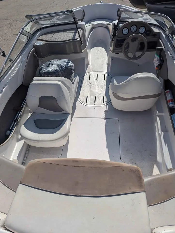 Slide: The Image of 2003 Four Winns Freedom 170 boat interior with seating and dashboard. - 6