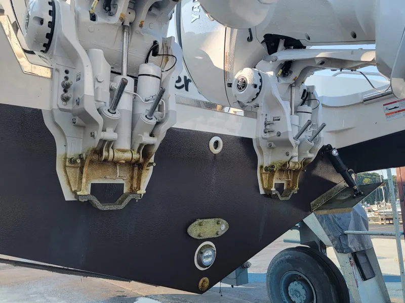 Slide: The Image of 2023 Pursuit S 328 Sport boat engines on a trailer, showcasing dual outboard motors. - 41