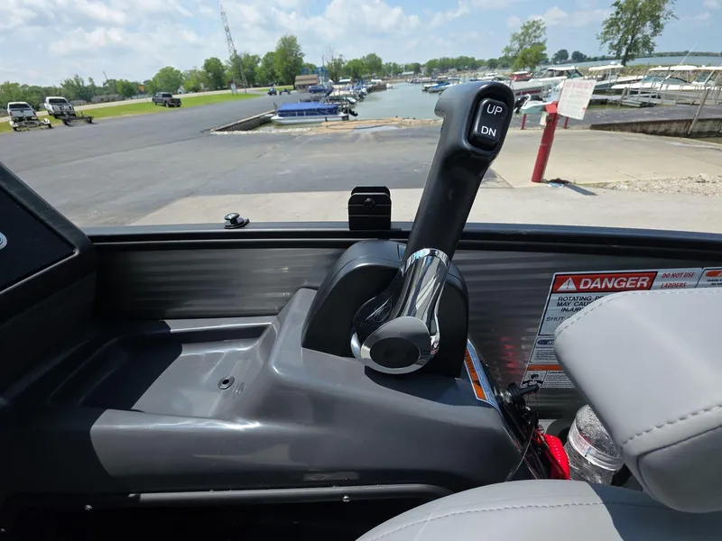 Slide: The Image of Control lever of a 2025 Bennington M Line boat at a marina. - 16