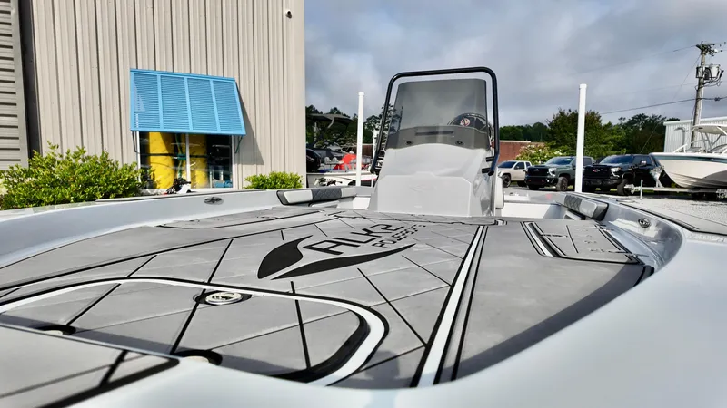 Slide: The Image of 2025 ALK2 Powerboats 21 BHX, sleek design, docked outdoors, modern features. - 10