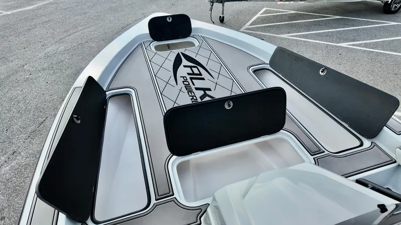 Slide: The Image of 2025 ALK2 Powerboats 21 BHX deck with storage compartments and logo. - 3