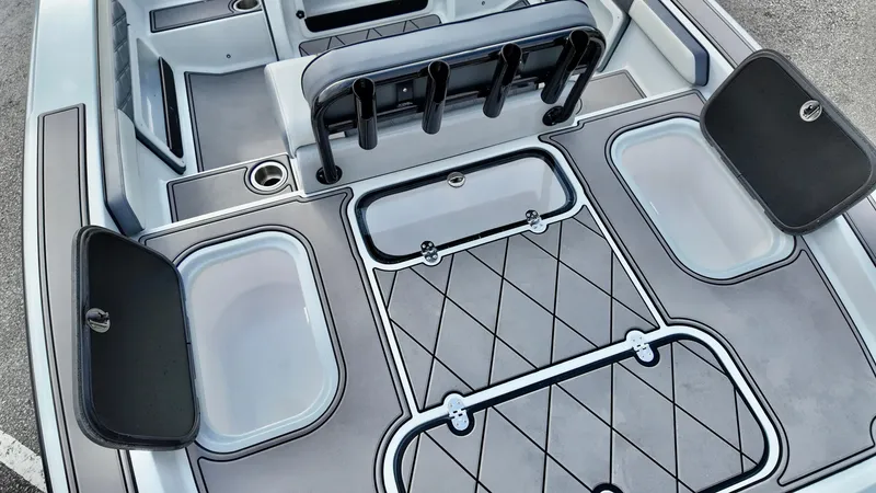 Slide: The Image of 2025 ALK2 Powerboats 21 BHX interior, featuring storage compartments and seating. - 4