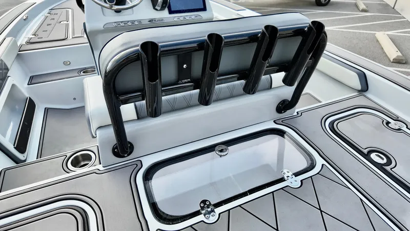 Slide: The Image of 2025 ALK2 Powerboats 21 BHX interior with rod holders and storage compartments. - 6