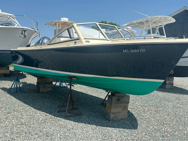 Slide: The Image of 2018 Rossiter 20 Coastal Cruiser boat on stands, displayed outdoors. - 1