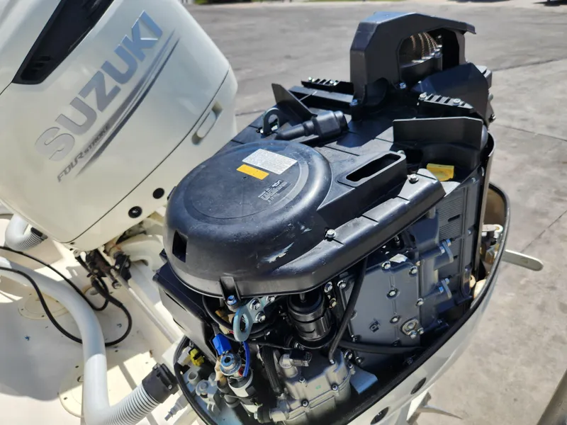 Slide: The Image of 2005 Pursuit 3070 Offshore Center Console with Suzuki outboard engine, detailed view. - 16