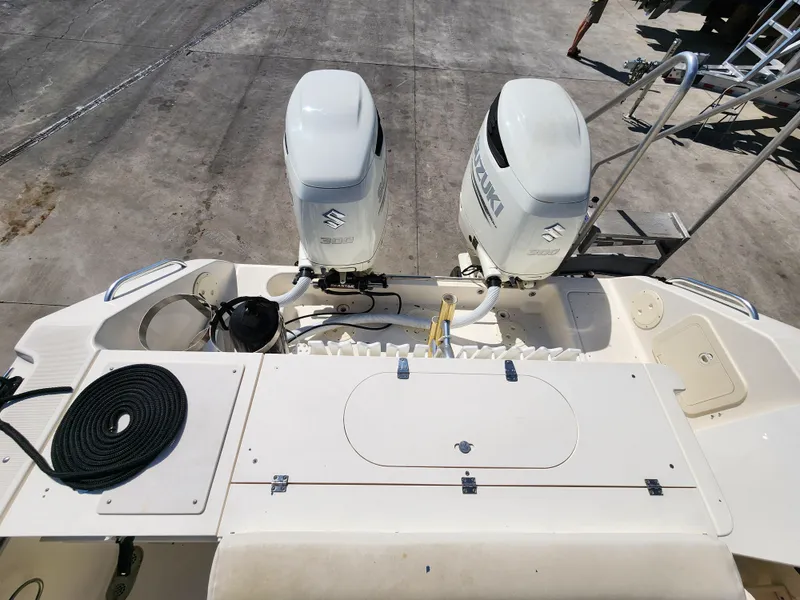Slide: The Image of 2005 Pursuit 3070 Offshore Center Console boat with dual Suzuki outboard engines. - 22