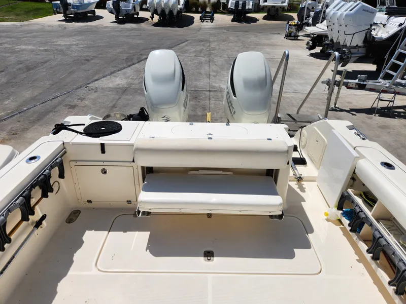 Slide: The Image of 2005 Pursuit 3070 Offshore Center Console boat with dual engines and spacious deck layout. - 24