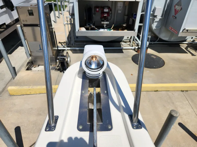 Slide: The Image of 2005 Pursuit 3070 Offshore Center Console spotlight and railing detail at dock. - 39